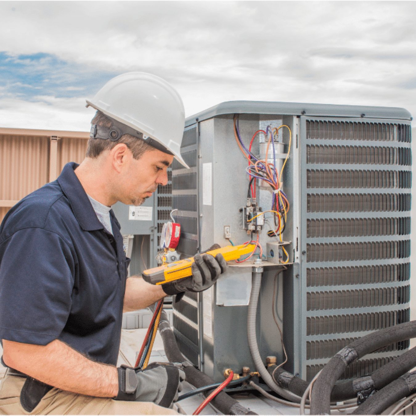 Milton Heating & Cooling HVAC technician servicing a system